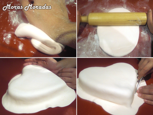cubrir el pastel de corazón con el fondant de nubes cubrir el pastel de corazón con el fondant de nubes